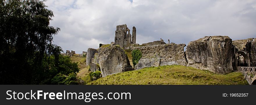 A photograph of castle ruins on a hill side