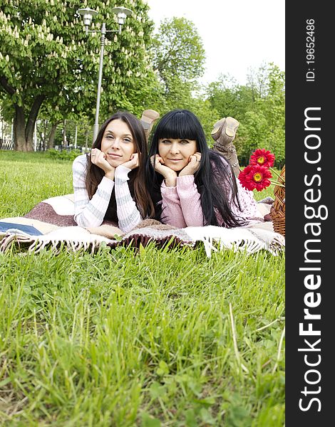 Portrait of smiling mother and teenage daughter in the park happy. Portrait of smiling mother and teenage daughter in the park happy