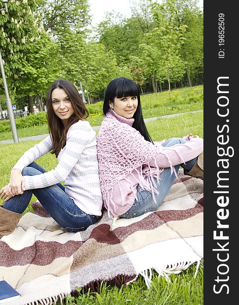 Portrait of smiling mother and teenage daughter in the park happy. Portrait of smiling mother and teenage daughter in the park happy