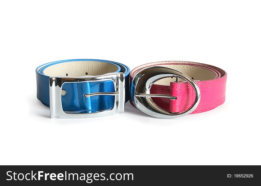 Blue and pink leather belts on white background. Clipping path is included. Blue and pink leather belts on white background. Clipping path is included