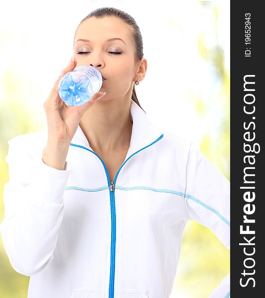 Young beautiful woman with bottle of water