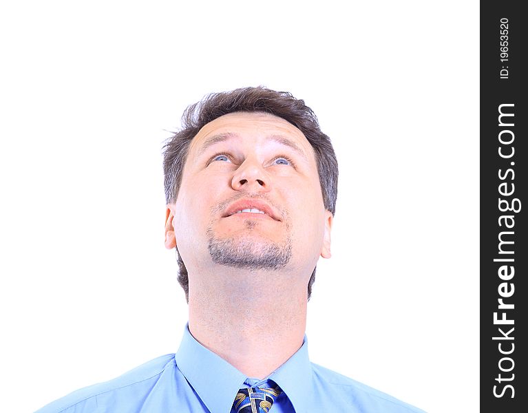 Isolated close-up portrait of a senior businessman. Cheerful and in a suit, looking up.