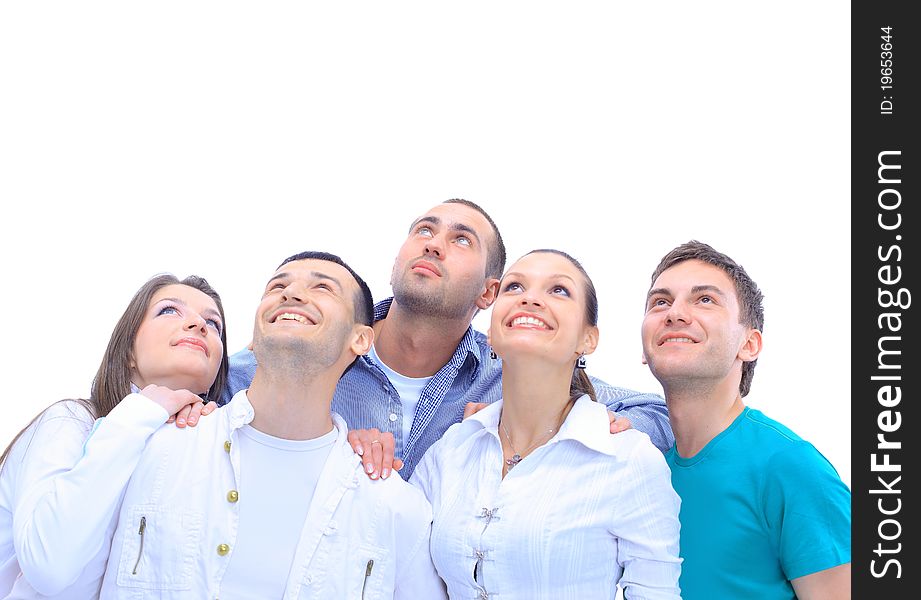 Closeup portrait of many men and women smiling and looking upwards against white background