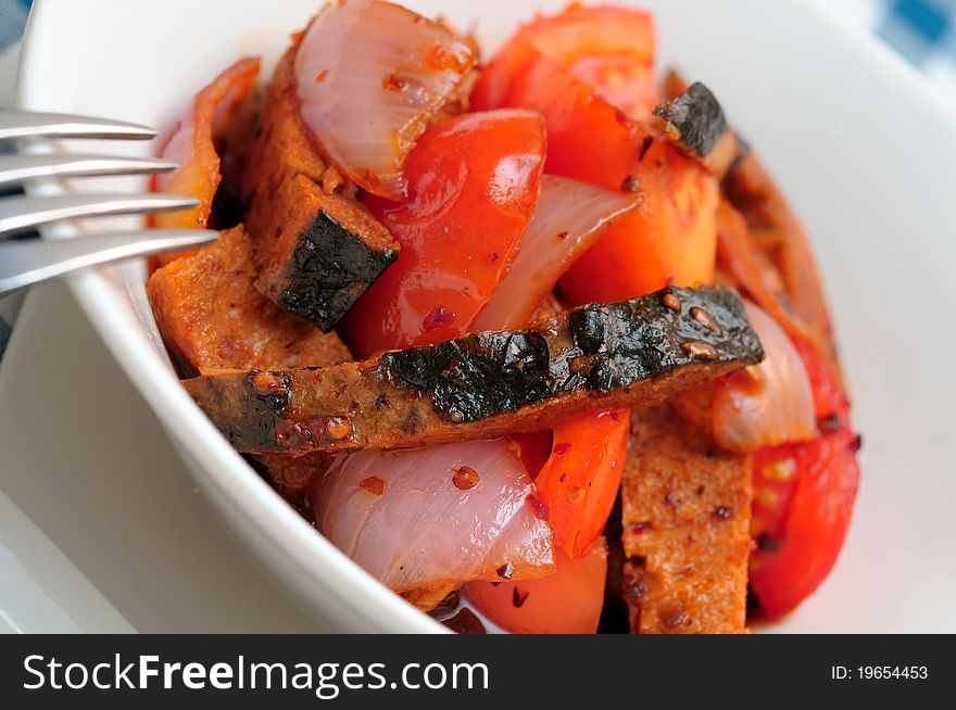Sweet and sour fish slices topped with spicy hot sauce. Sweet and sour fish slices topped with spicy hot sauce.