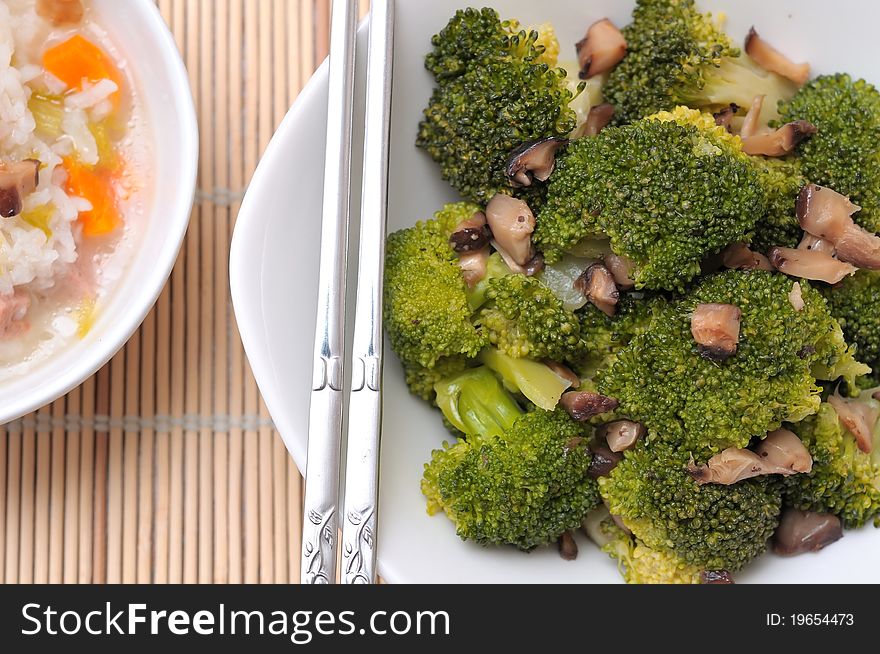 Freshly served green broccoli delicacy served in white bowl. Freshly served green broccoli delicacy served in white bowl.