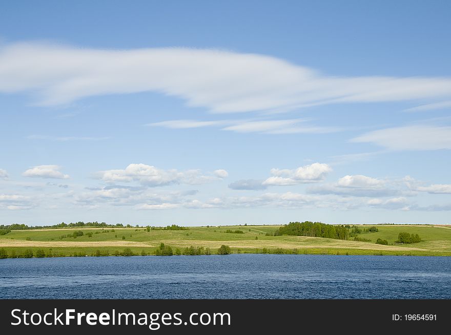 Spring. A beautiful landscape - the river and a field. Spring. A beautiful landscape - the river and a field