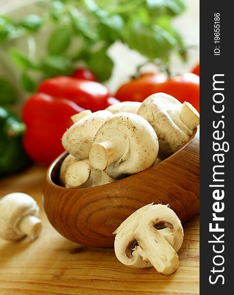 Fresh Mushrooms In Wooden Bowl