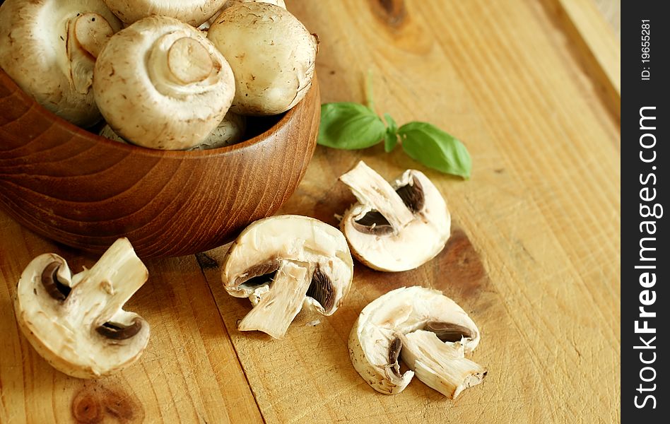 Fresh Mushrooms In Wooden Bowl