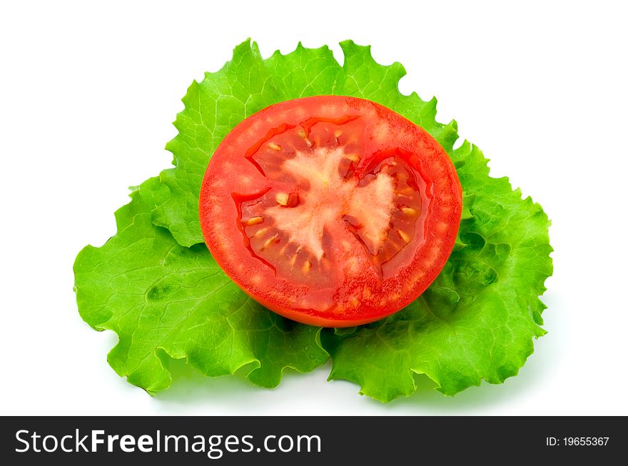 Red tomatoes and lettuce on a white background