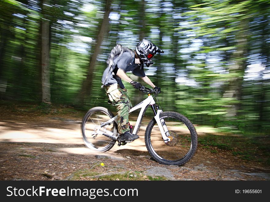 Downhill mountain bikers in nature
