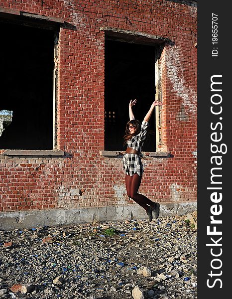 Portrait with happy young woman jumping