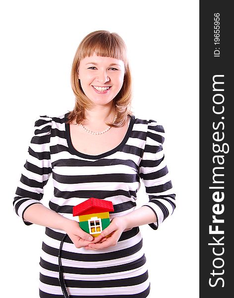 Young woman with house's model. Isolated on white background.