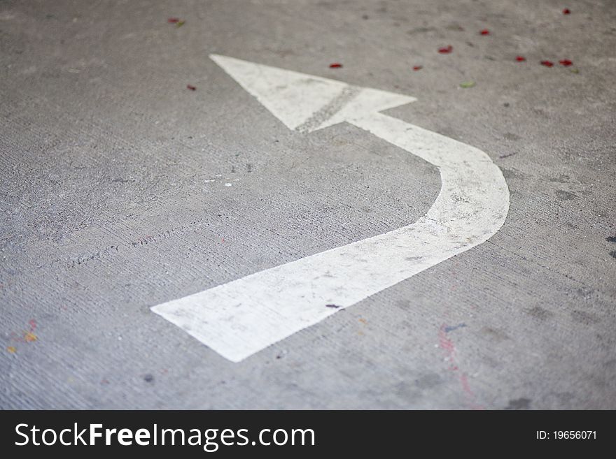 Sign arrow color white turn left.arrow white turn left on the road. Sign arrow color white turn left.arrow white turn left on the road.