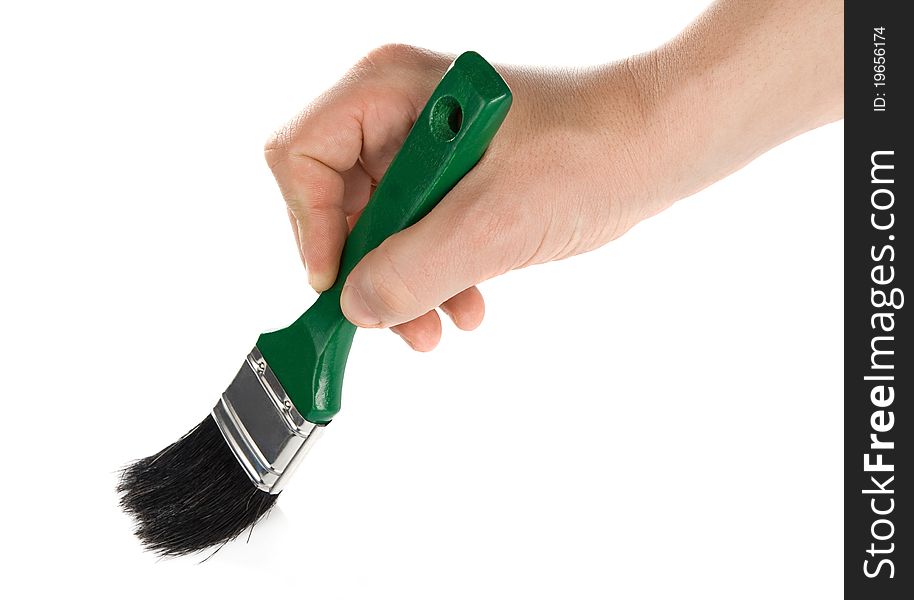 Male hand and green brush isolated on white background