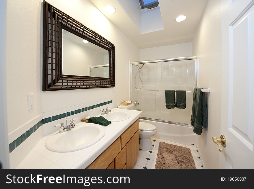 Bathroom with shower stall and two sinks