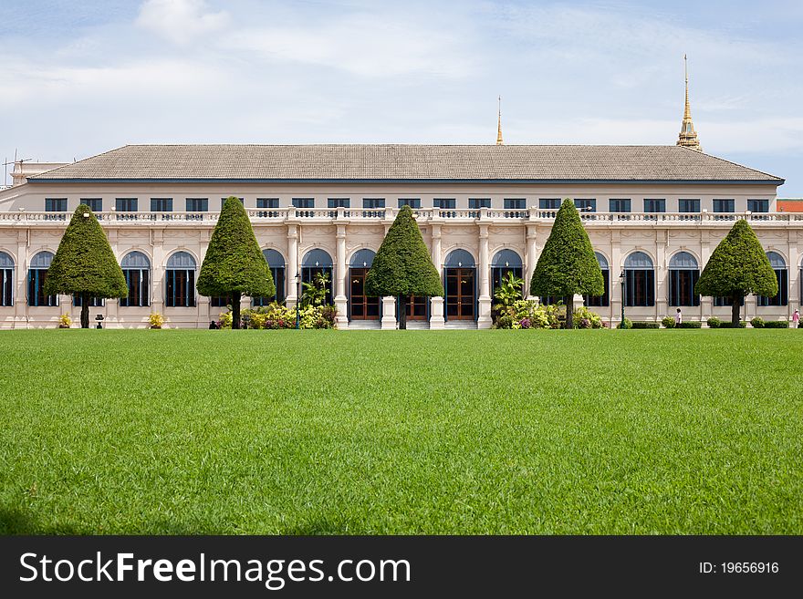 Building And Grass On The Sky