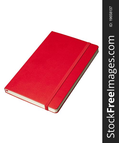 Red notepad at angle from above isolated against a white background