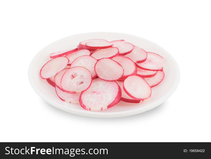 Sliced radishes in a plate on a white background. Sliced radishes in a plate on a white background.
