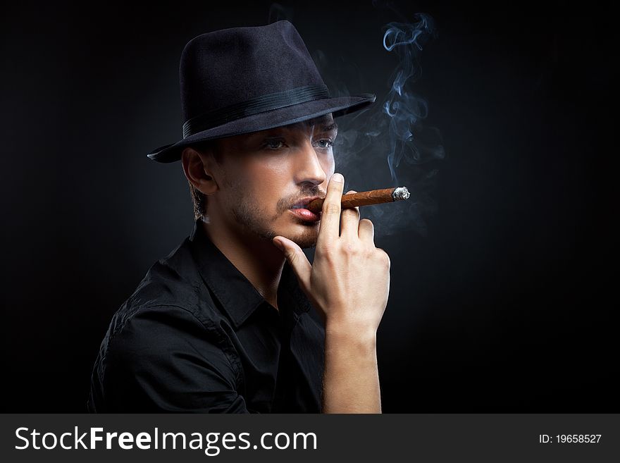 Man With Hat And Cigar In Black & White