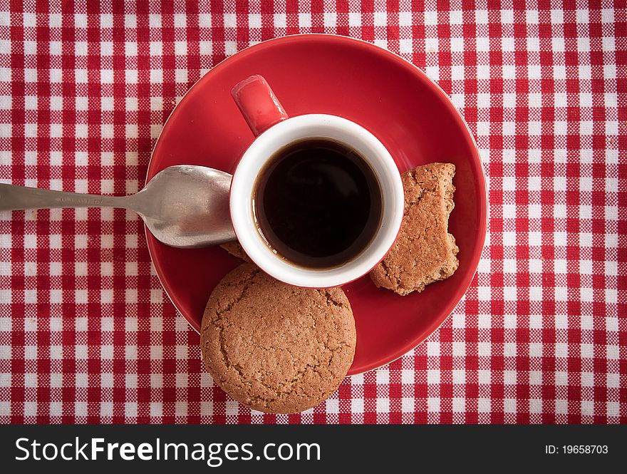 Morning fragrance: a cup of fresh coffee with ginger biscuits, detail. Morning fragrance: a cup of fresh coffee with ginger biscuits, detail