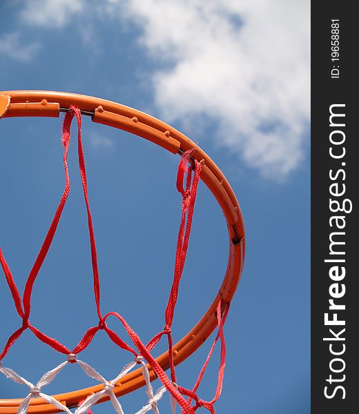 Fragment of the basket for basket against a slightly cloudy sky