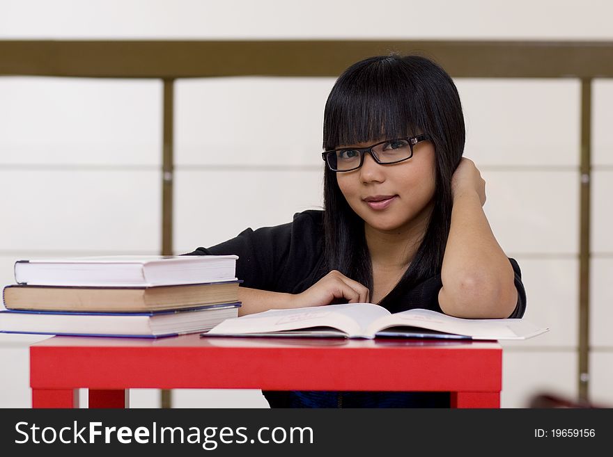 Young girl reading books