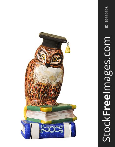 Figure of an owl with books on the white isolated background