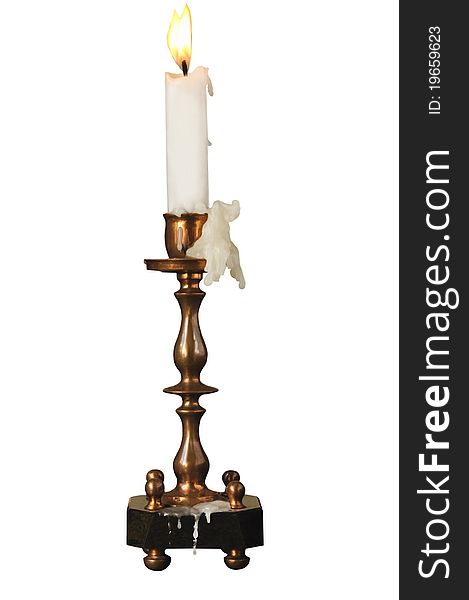 Candlestick ancient with a candle on the white isolated background