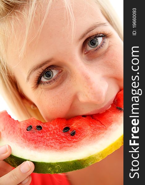 Closeup of a young girl eating watermelon