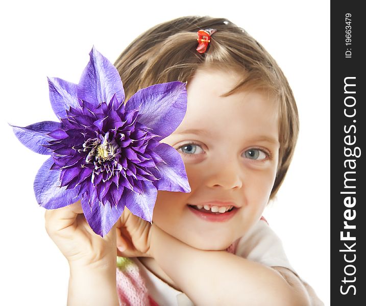 Little girl with blue clematis flower isolated on white background. Little girl with blue clematis flower isolated on white background