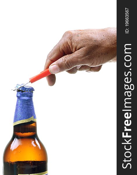 Male hand opening beer bottle with opener.