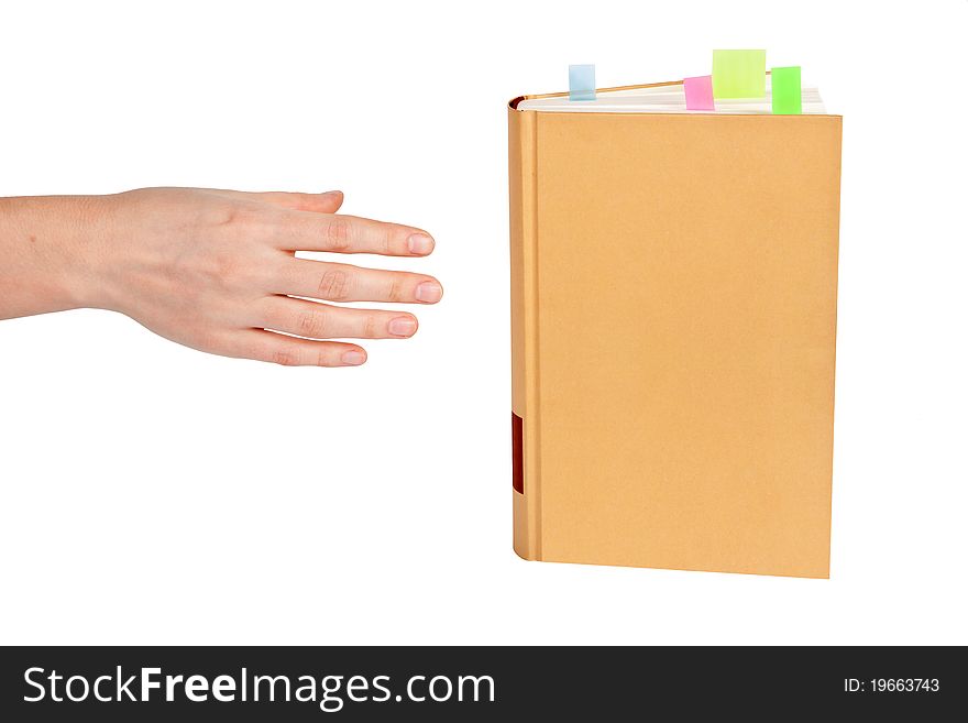 Hand goes to the book on white