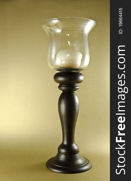 Wooden candle holder with golden background. Wooden candle holder with golden background