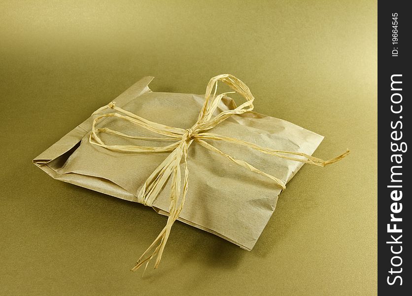 Gift box on a golden background