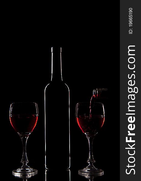 Red wine - silluette of bottle and glasses with red wine. Red wine - silluette of bottle and glasses with red wine