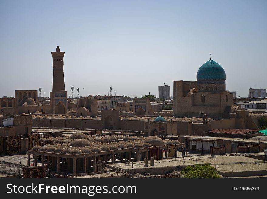 Classic view to Bukhara old city view with mosque and minaret