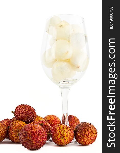 Litchi in wine glass isolated on white background