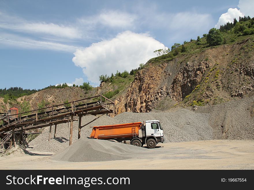 Stone quarry scenery with truck and sorting station