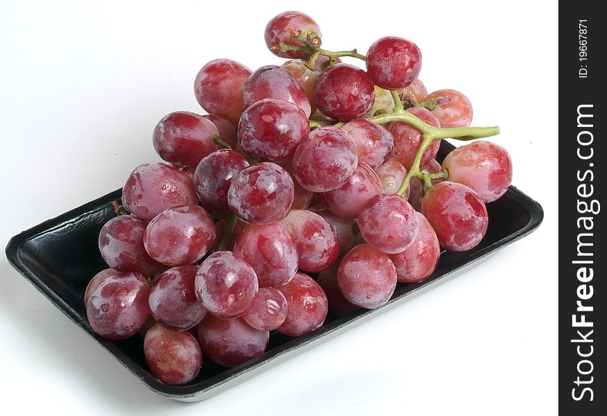 Fresh and delicious grapes isolated on white