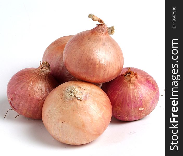 Golden onion on white background.