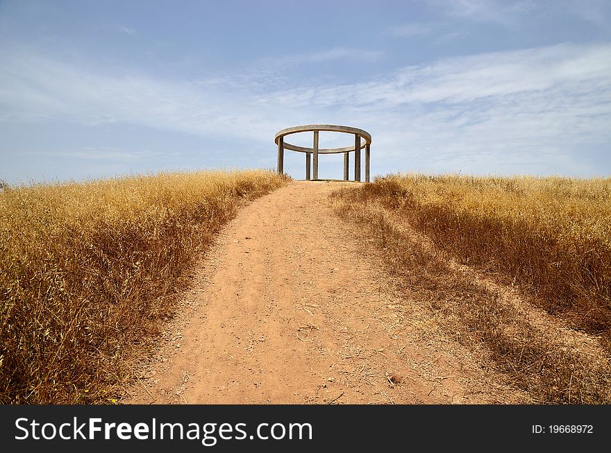 Concrete pergola on a hill in the form of a ring on the columns. Concrete pergola on a hill in the form of a ring on the columns