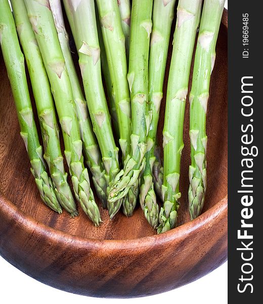 Green asparagus in wooden bowl. Green asparagus in wooden bowl