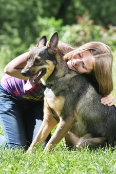 Girl With Dog Outdoors Stock Image