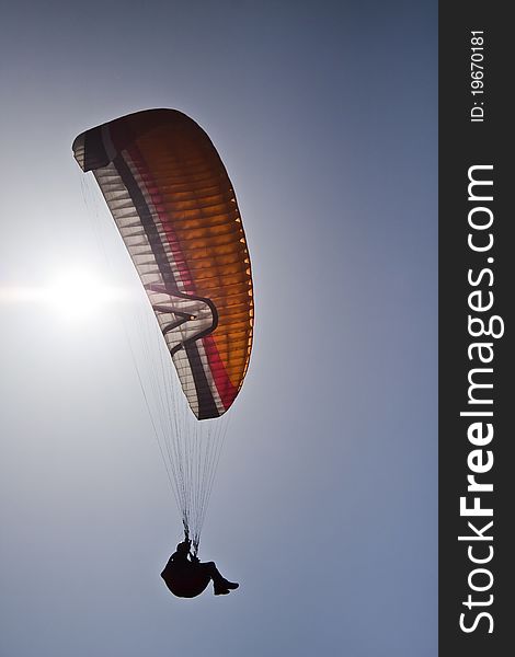 Paragliding by flying free under the sun. Paragliding by flying free under the sun