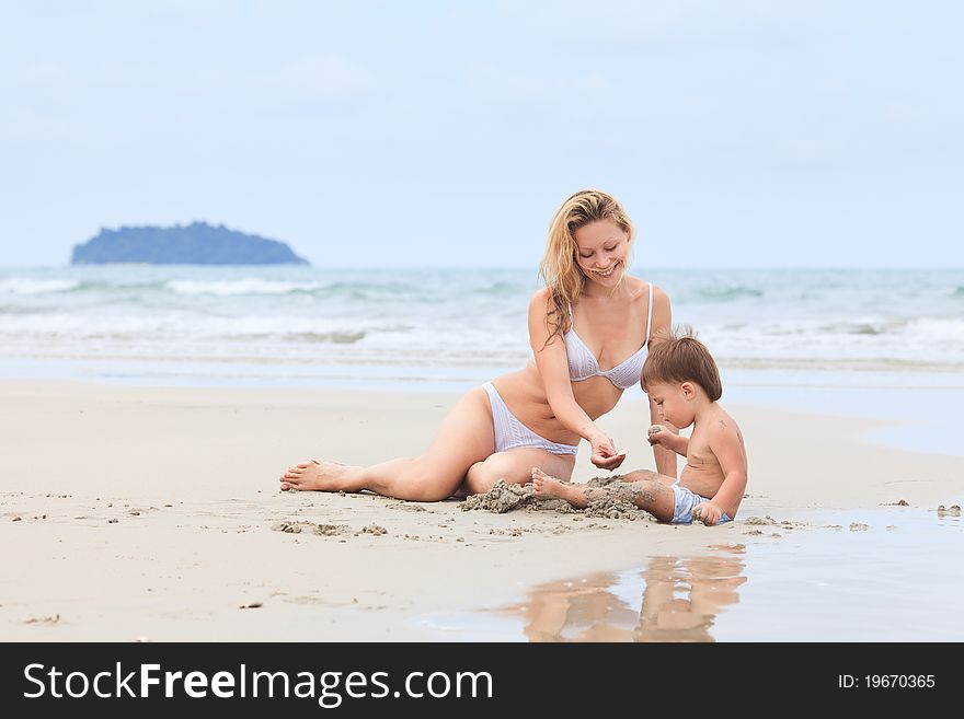 Baby with mother on a beach. Baby with mother on a beach