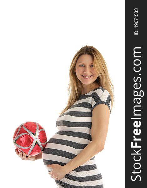 Pregnant woman with soccer ball isolated on white