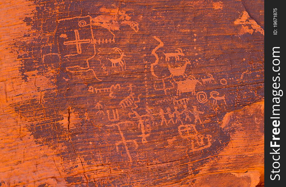 Petrogliphs found on the vibrant canyon walls of Valley of Fire. Petrogliphs found on the vibrant canyon walls of Valley of Fire