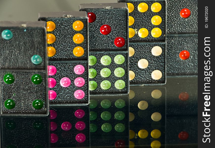 Colorful Dominoes on reflect background