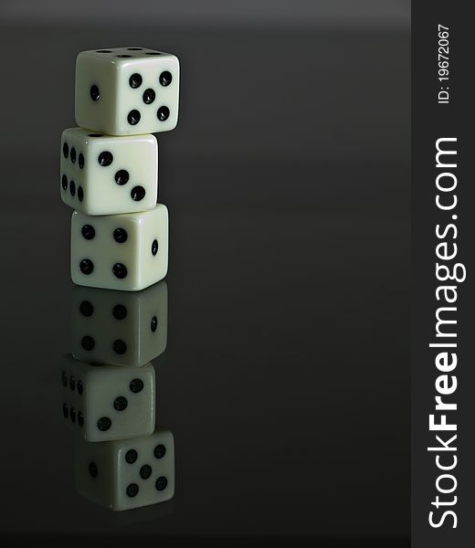 Three white dices stack as tower