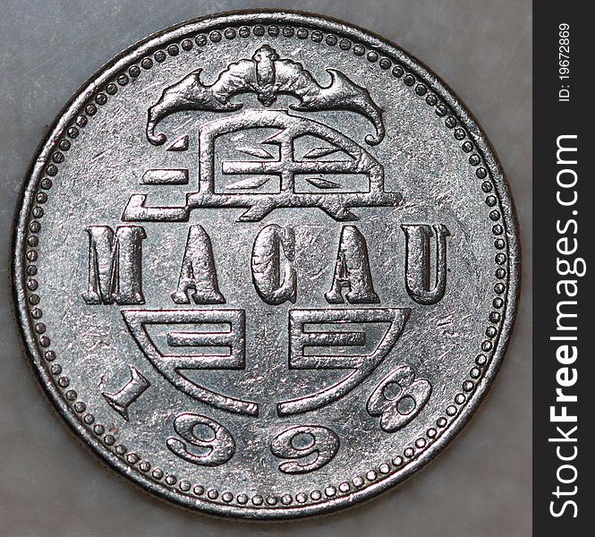 A single pataca coin from 1998. Currency of Macau SAR. A single pataca coin from 1998. Currency of Macau SAR.